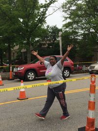 Full length of man standing on car