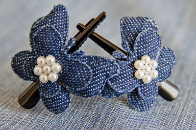 Close-up of hair clips on table