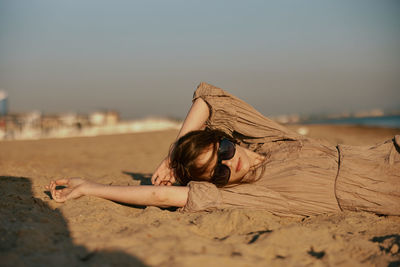 Young woman relaxing at beach