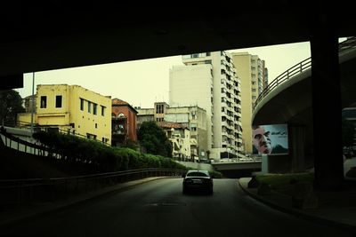 Road along buildings in city