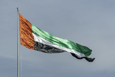 Low angle view of flag against sky