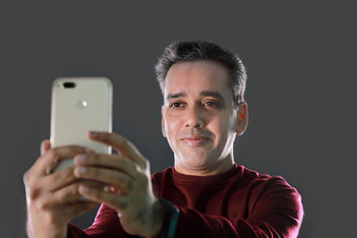 Portrait of man using smart phone