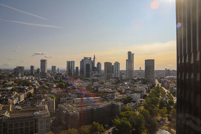 Aerial view of modern buildings in frankfurt  main against sky during sunset