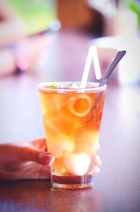 Close-up of hand holding drink