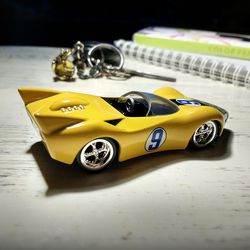 Close-up of yellow toy car on table
