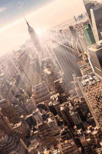 High angle view of modern buildings in city against sky