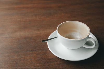 High angle view of coffee cup on table