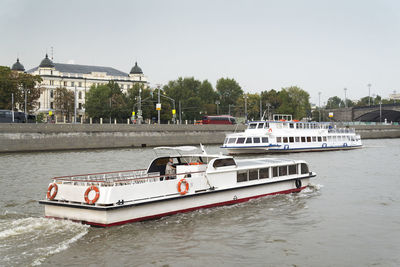 Boat in river against sky