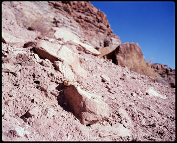 Low angle view of rock against clear sky