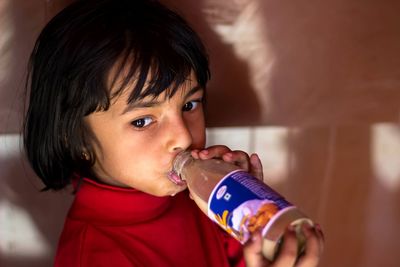 Close-up portrait of boy eating food