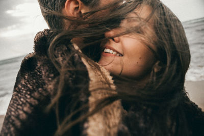 Close-up portrait of a smiling young woman