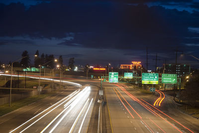 Light trails on road in city at night