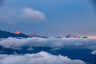 Low angle view of snowcapped mountains against sky during sunset