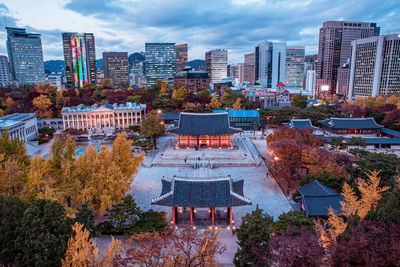 High angle view of buildings in city against sky