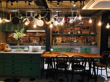 Empty chairs and tables in kitchen 