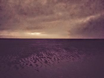 Scenic view of sea against sky at sunset