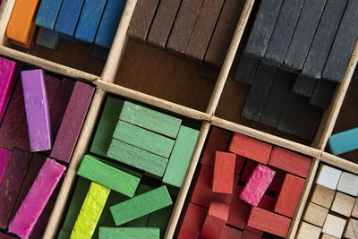 High angle view of multi colored wooden blocks in shelf