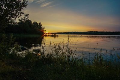 Scenic view of lake during sunset