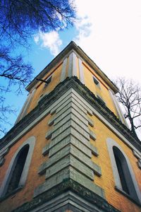 Low angle view of building against cloudy sky