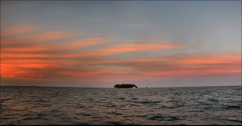 Scenic view of sea at sunset