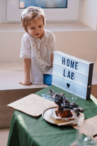 Preschooler boy experimenting in the home laboratory and studying the chemical properties