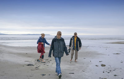 Family walking on beach