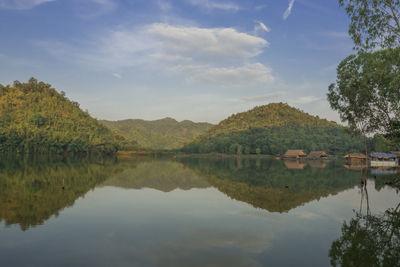 Scenic view of lake and mountains against sky