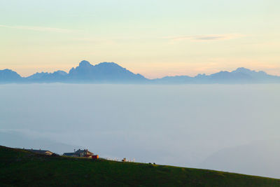 Scenic view of mountains against sky during sunset