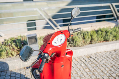 Close-up of red vintage car on street