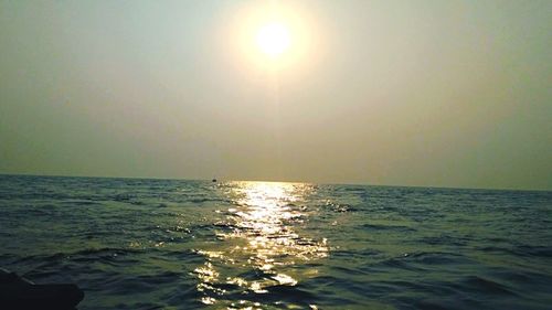 Scenic view of sea against clear sky during sunset