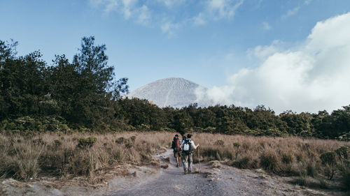 Man walking on dirt road