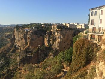 Panoramic view of buildings in city against clear sky