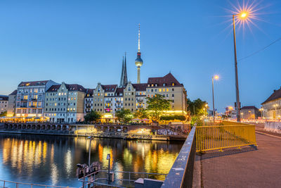 The nikolaiviertel, the river spree and the television tower in berlin at twilight