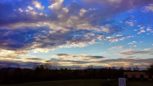 Scenic view of landscape against cloudy sky