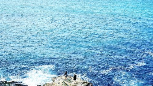 Scenic view of sea against blue sky