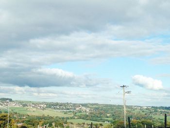 Landscape against cloudy sky