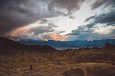 Scenic view of landscape against cloudy sky