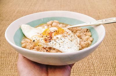 Cropped image of hand holding food