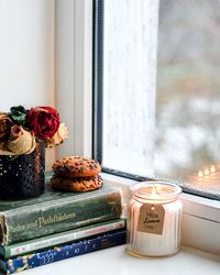 Close-up of objects on window sill