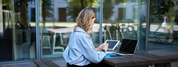 Young woman using laptop at office