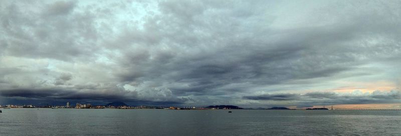 Scenic view of sea against storm clouds