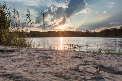 Scenic view of lake against sky during sunset