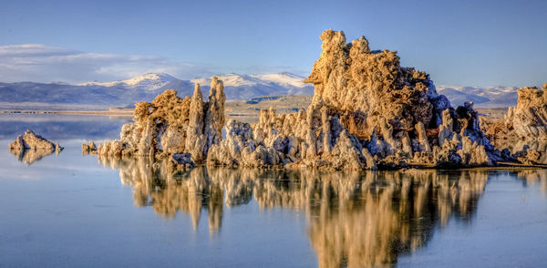 Panoramic view of lake and snowcapped mountains against sky