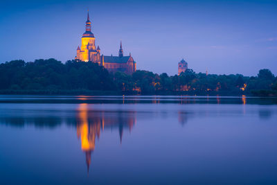 Reflection of illuminated buildings in water