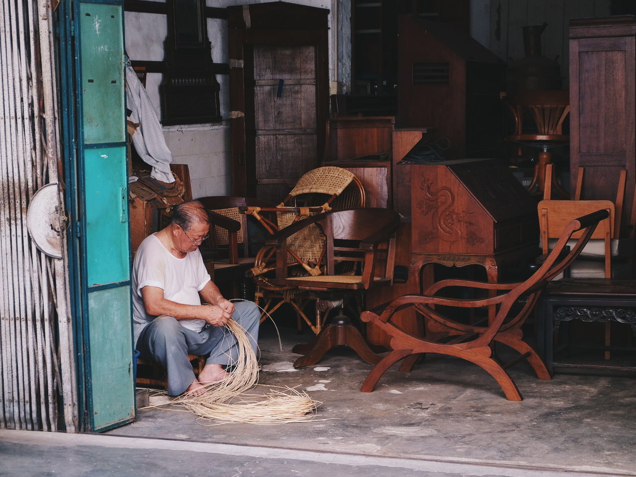 real people, one person, sitting, full length, indoors, adult, lifestyles, seat, chair, casual clothing, architecture, young adult, men, women, building, day, leisure activity, looking