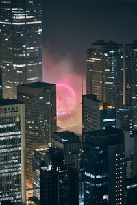 Illuminated buildings in city at night