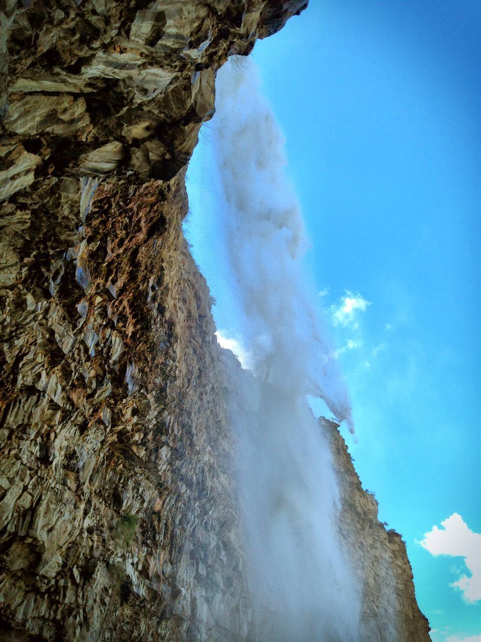 LOW ANGLE VIEW OF ROCK FORMATION AGAINST SKY