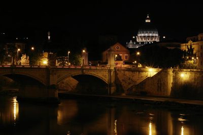 Bridge over river at night