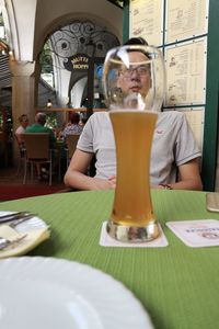 High angle view of beer glass on table at restaurant