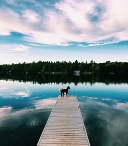 View of pier on lake against sky